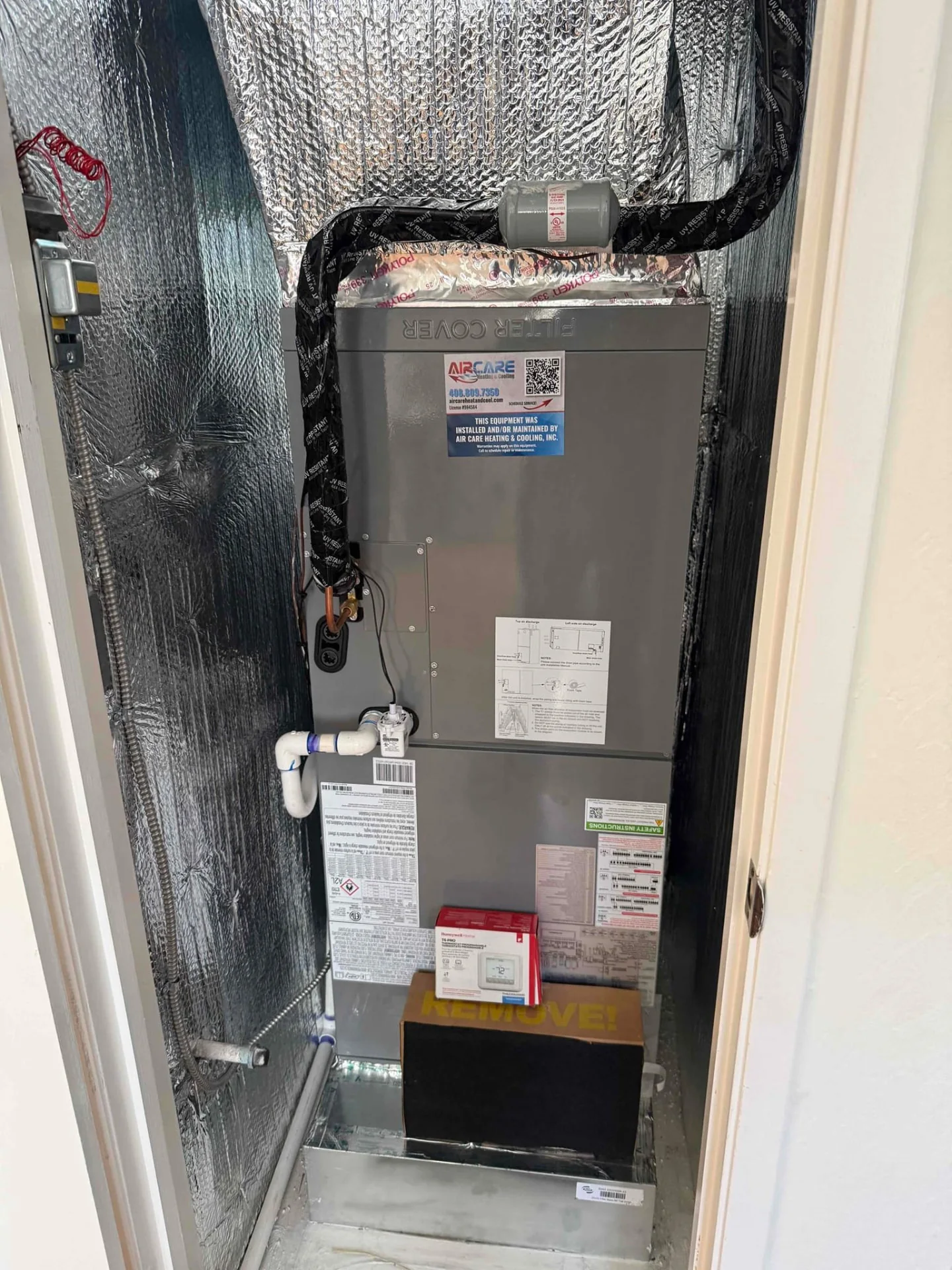 Indoor HVAC cabinet and insulated ductwork in a closet