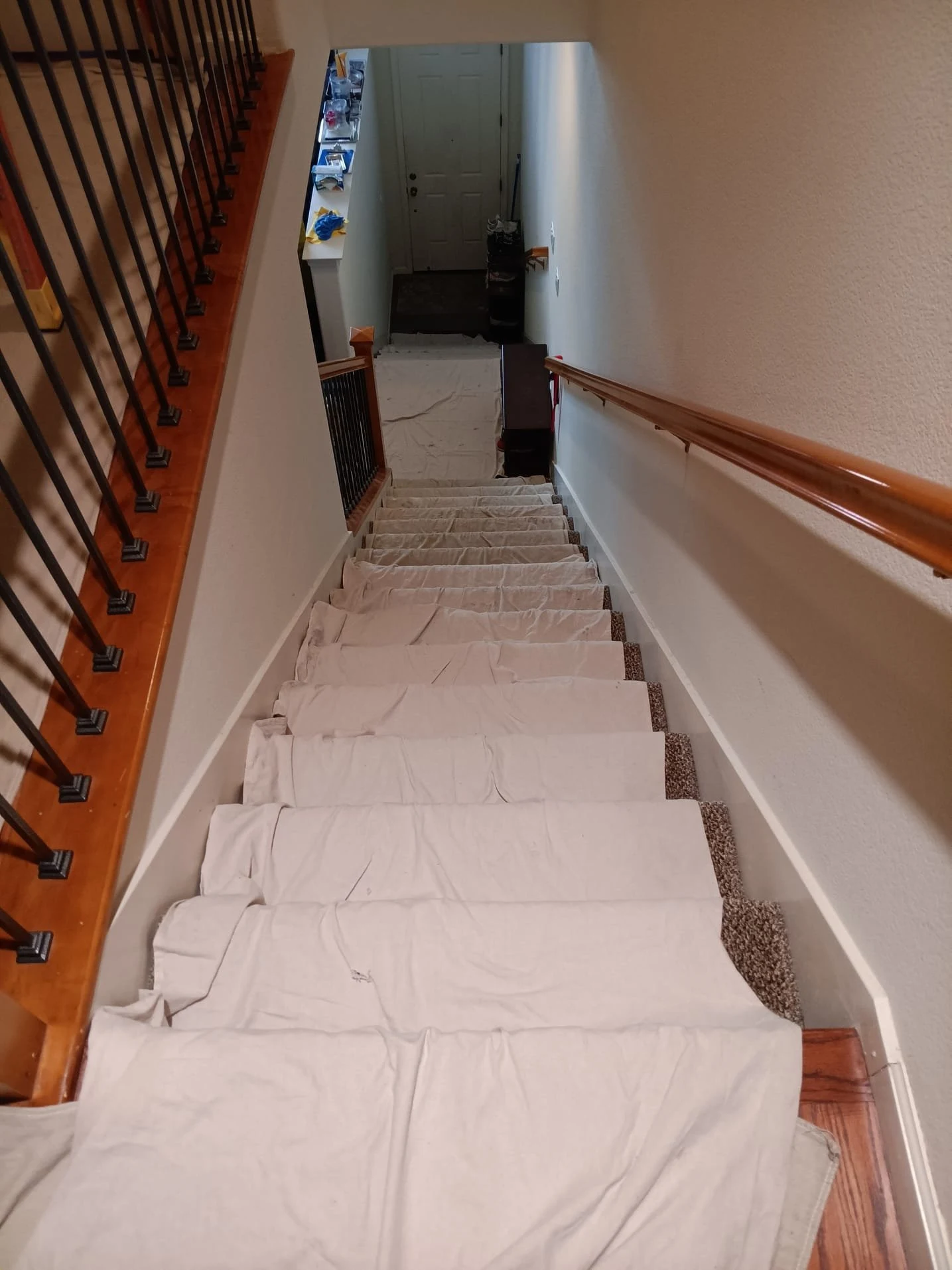 Interior staircase covered with protective drop cloths
