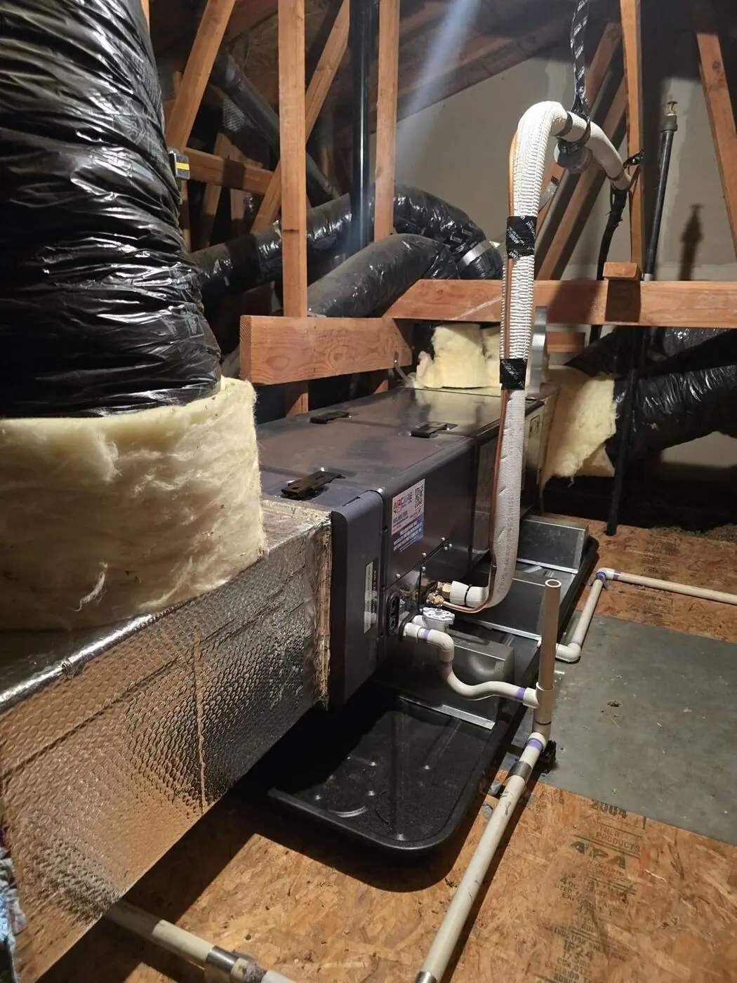 Attic air handler connected to the home’s existing insulated ductwork and refrigerant line set