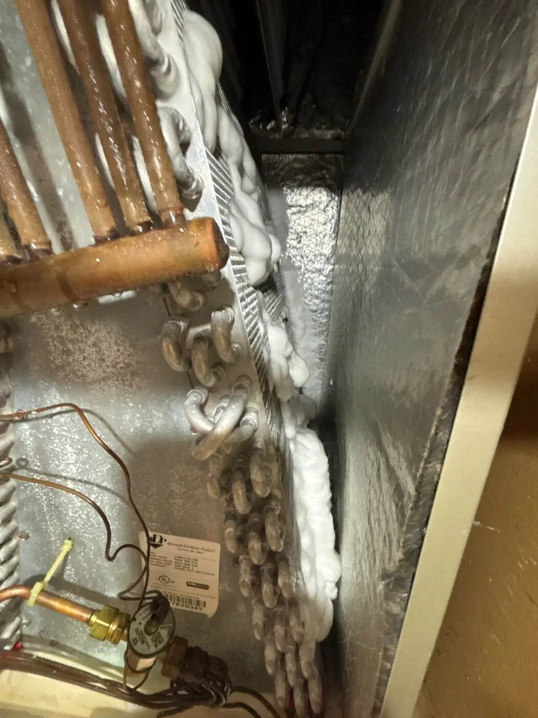 Indoor evaporator coil with frost buildup and copper refrigerant tubing in Mountain View, CA 94040