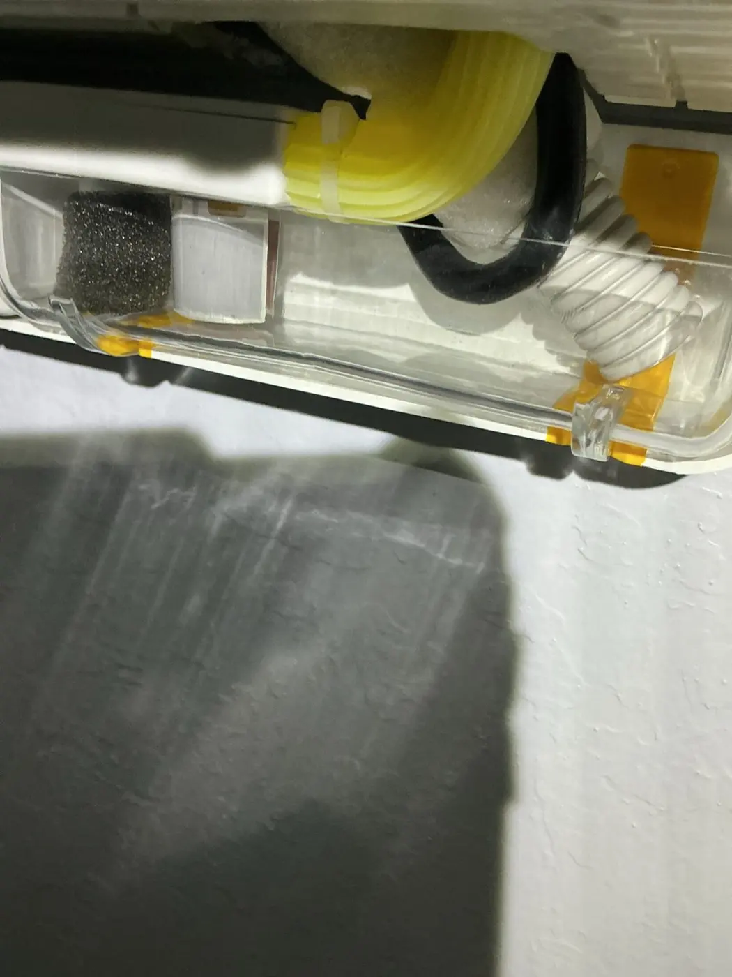 Close-up of a condensate pump and drain line assembly inside a ductless mini-split indoor unit in Santa Clara, CA 95051