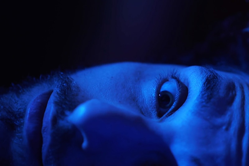 Man in blue light